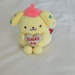Sanrio Pompompurin Plush in Yellow with Pink Hat and Multicolor Heart Details